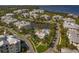 Community featuring a pool, pond and lush tropical landscaping at 7840 34Th Ave W # 303, Bradenton, FL 34209