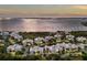 Aerial view of luxurious condos with waterfront views, lush landscaping, and resort-style amenities at 7840 34Th Ave W # 303, Bradenton, FL 34209