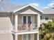 Balcony with U.S. Flag, seating, and community view at 7840 34Th Ave W # 303, Bradenton, FL 34209