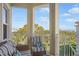 Enjoy the fresh air and scenic views from this cozy balcony with comfortable seating at 7840 34Th Ave W # 303, Bradenton, FL 34209