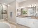 A spacious bathroom with double sinks, granite countertops, and modern fixtures at 7840 34Th Ave W # 303, Bradenton, FL 34209