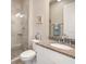 Modern bathroom with walk-in shower, granite countertop, and decorative mirror and towel in soothing blue tones at 7840 34Th Ave W # 303, Bradenton, FL 34209