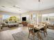 Open-concept dining and living area with lots of natural light and modern furnishings at 7840 34Th Ave W # 303, Bradenton, FL 34209