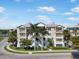 Beautiful condo complex featuring private balconies, lush tropical landscaping, and a charming coastal design at 7840 34Th Ave W # 303, Bradenton, FL 34209