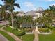 Beautiful home with lush landscaping including mature palms and colorful flower beds at 7840 34Th Ave W # 303, Bradenton, FL 34209