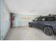 Spacious garage featuring high ceilings, car, and fire suppression equipment at 7840 34Th Ave W # 303, Bradenton, FL 34209