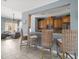 Stylish kitchen bar area featuring barstools, cabinets, and a view into a comfortable seating area at 7840 34Th Ave W # 303, Bradenton, FL 34209