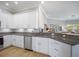Contemporary kitchen with granite counters, stainless steel appliances, and white cabinets at 7840 34Th Ave W # 303, Bradenton, FL 34209