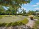 Enjoy the community putting green surrounded by lush landscaping and tropical palm trees at 7840 34Th Ave W # 303, Bradenton, FL 34209