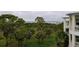 Scenic view of lush tropical foliage and waterway from the balcony of a residence at 7840 34Th Ave W # 303, Bradenton, FL 34209