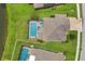 Aerial view of home highlighting the screened pool, well-manicured lawn, and overall property layout at 7930 111Th Ter E, Parrish, FL 34219