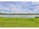 Beautiful backyard showcasing a tranquil lake view and verdant green space at 7930 111Th Ter E, Parrish, FL 34219
