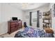 Well lit bedroom with a dark wood dresser, decorative wall art and a cozy atmosphere at 7930 111Th Ter E, Parrish, FL 34219