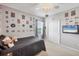 Bright bedroom featuring wall art, a ceiling fan and a comfortable bed with plush cushions at 7930 111Th Ter E, Parrish, FL 34219
