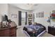 Charming bedroom featuring a glowing bedframe, stylish decorations and natural light from the window at 7930 111Th Ter E, Parrish, FL 34219