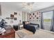 Stylized bedroom filled with decorations including wall art, hanging vines and a disco ball at 7930 111Th Ter E, Parrish, FL 34219