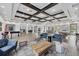 Spacious clubhouse with light hardwood floors, dark wood beams, a billiards table and comfortable seating at 7930 111Th Ter E, Parrish, FL 34219