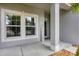 Welcoming front porch featuring a charming welcome sign and decorative elements at 7930 111Th Ter E, Parrish, FL 34219