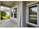 Cozy front porch featuring a welcome mat and a view of the well-maintained yard at 7930 111Th Ter E, Parrish, FL 34219