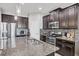 Elegant kitchen with granite countertops, stainless steel appliances, and decorative backsplash at 7930 111Th Ter E, Parrish, FL 34219