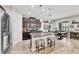Gourmet kitchen with island, granite countertops, stainless steel appliances, and adjacent dining area at 7930 111Th Ter E, Parrish, FL 34219