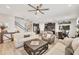 Bright and spacious open-concept living room with elegant furnishings, and seamless flow to the kitchen at 7930 111Th Ter E, Parrish, FL 34219