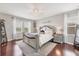 Beautiful bedroom with hardwood floors, a ceiling fan, and natural light from the windows at 7930 111Th Ter E, Parrish, FL 34219