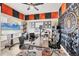 Unique office space with creative soundproofing, decorative wall art, and well-lit workspace with a large monitor at 7930 111Th Ter E, Parrish, FL 34219