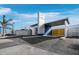 Modern commercial building featuring a sleek design with a covered entrance and ample parking at 8100 Ciboney Ct # 10, Sarasota, FL 34240