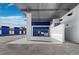 Wide angle view of a wash basin inside an industrial space with roll-up garage doors and bright blue accents at 8100 Ciboney Ct # 10, Sarasota, FL 34240