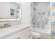 Modern bathroom featuring marble countertops and a tiled shower with glass door at 9007 63Rd Avenue E Dr, Bradenton, FL 34202