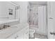 Bathroom featuring marble vanity, bathtub with white shower curtain and modern fixtures at 9007 63Rd Avenue E Dr, Bradenton, FL 34202