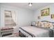 Cozy bedroom featuring a comfortable bed, ceiling fan, and bright window at 9007 63Rd Avenue E Dr, Bradenton, FL 34202