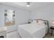 Cozy bedroom with a ceiling fan, and natural light from the bright window at 9007 63Rd Avenue E Dr, Bradenton, FL 34202