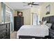 Primary bedroom with dark furniture set and a sliding barn door at 9007 63Rd Avenue E Dr, Bradenton, FL 34202