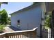 Side view of the home with a wooden fence, well-kept yard and exterior light fixture at 9007 63Rd Avenue E Dr, Bradenton, FL 34202