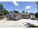 Charming home with a well-manicured lawn, spacious driveway, and solar panels at 9007 63Rd Avenue E Dr, Bradenton, FL 34202
