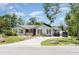 Charming single-story home with a stone-lined driveway and well-maintained landscaping at 9007 63Rd Avenue E Dr, Bradenton, FL 34202