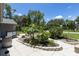 Beautifully landscaped front yard featuring decorative stone and lush greenery, enhancing curb appeal at 9007 63Rd Avenue E Dr, Bradenton, FL 34202