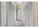 Hallway between rows of closets and a skylight above at 9007 63Rd Avenue E Dr, Bradenton, FL 34202