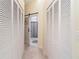 Bright hallway featuring a closet and access to the primary bathroom at 9007 63Rd Avenue E Dr, Bradenton, FL 34202