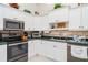 Well-lit kitchen featuring stainless steel appliances and decorative accents at 9007 63Rd Avenue E Dr, Bradenton, FL 34202