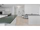 Bright kitchen featuring tile floors, ample cabinet space, and modern appliances at 9007 63Rd Avenue E Dr, Bradenton, FL 34202