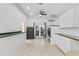 Laundry room with bright white cabinets, a gun safe, and glass doors to the back yard at 9007 63Rd Avenue E Dr, Bradenton, FL 34202