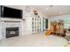 Bright living room boasts a marble fireplace, tile floors, and access to the outdoors at 9007 63Rd Avenue E Dr, Bradenton, FL 34202