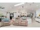 Spacious living room featuring comfortable seating, skylights, and an open layout at 9007 63Rd Avenue E Dr, Bradenton, FL 34202