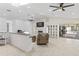 Spacious living area featuring tile floors, fireplace, and glass sliding doors to the patio at 9007 63Rd Avenue E Dr, Bradenton, FL 34202