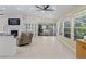Bright open-concept living area with tile floors and glass sliding doors to the patio at 9007 63Rd Avenue E Dr, Bradenton, FL 34202