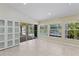 Sunroom with sliding glass doors leading to screened-in patio and view of the pool at 9007 63Rd Avenue E Dr, Bradenton, FL 34202