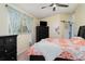 Bedroom featuring a ceiling fan, patterned curtains, and neutral paint at 9007 63Rd Avenue E Dr, Bradenton, FL 34202